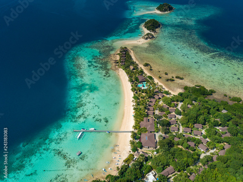 Aerial view of tropical island Bulalacao. Beautiful tropical island with white sandy beach, palm trees and green hills. Travel tropical concept. Palawan, Philippines © umike_foto