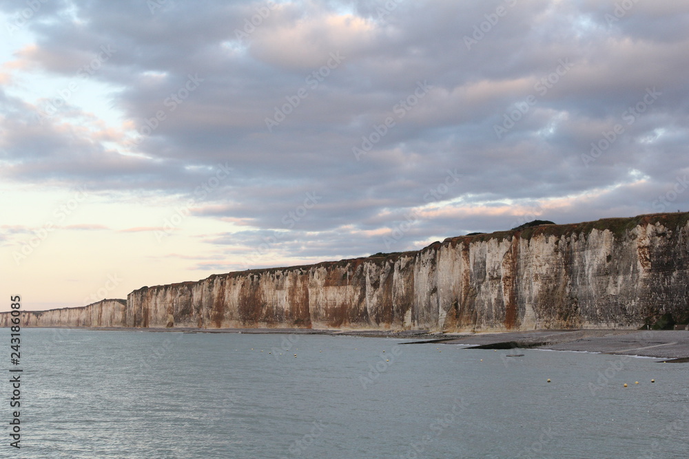 the white alabaster cliff coast with high tide in normandy, france