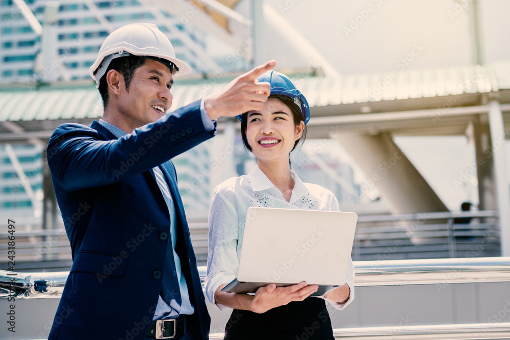 Happy woman working with her manager as trainee engineer Happy woman working with her manager as trainee engineer
