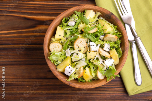 Delicious salad with frisee, mango, feta and crunchy croutons