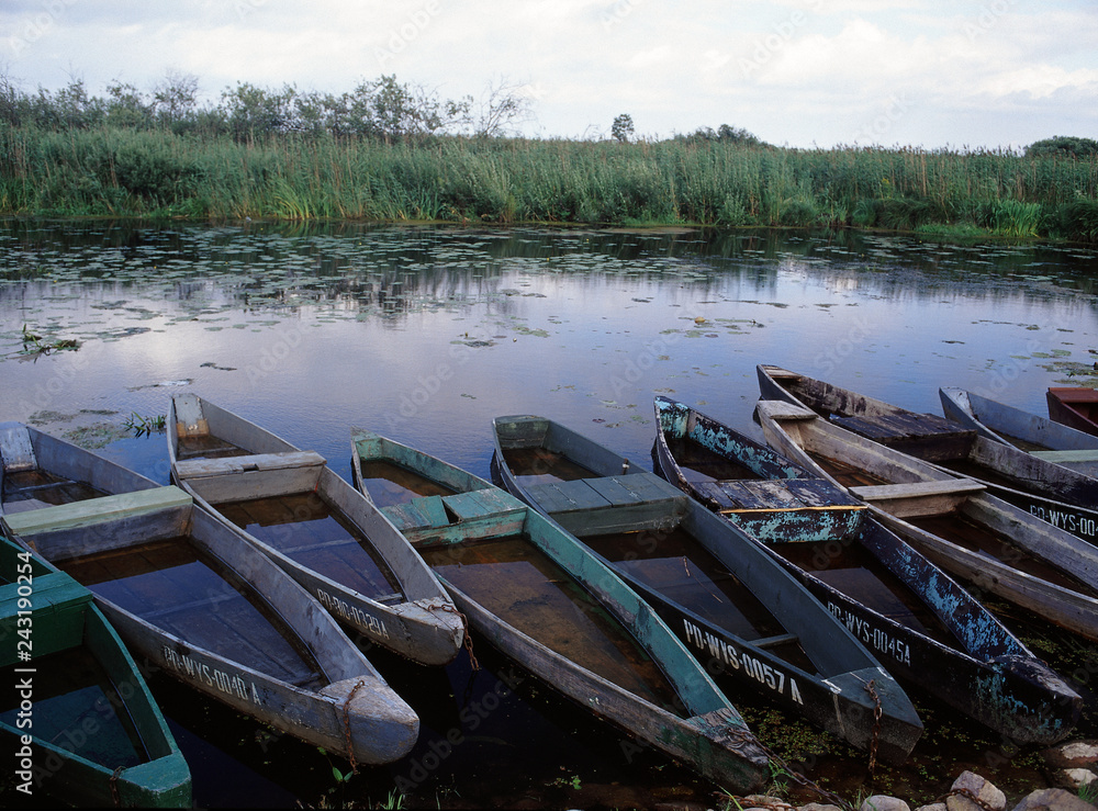 Φωτογραφία Kurowo, Poland - July, 2010: Narew National Park, boats in Kurowo and Narew rive