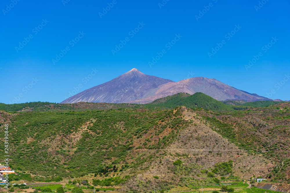 Valley of Montanas Negras. In the background Teide volcano. Viewpoint Mirador del Teide. Tenerife. Canary Islands. Spain. Valley of Montanas Negras. In the background Teide volcano. Viewpoint Mirador del Teide. Tenerife. Canary Islands. Spain.