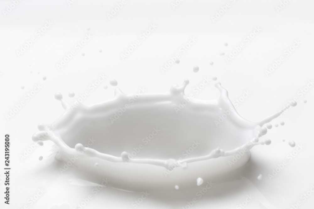 Milk splash with high speed photography.Pouring milk splash isolated on white background Milk splash with high speed photography.Pouring milk splash isolated on white background