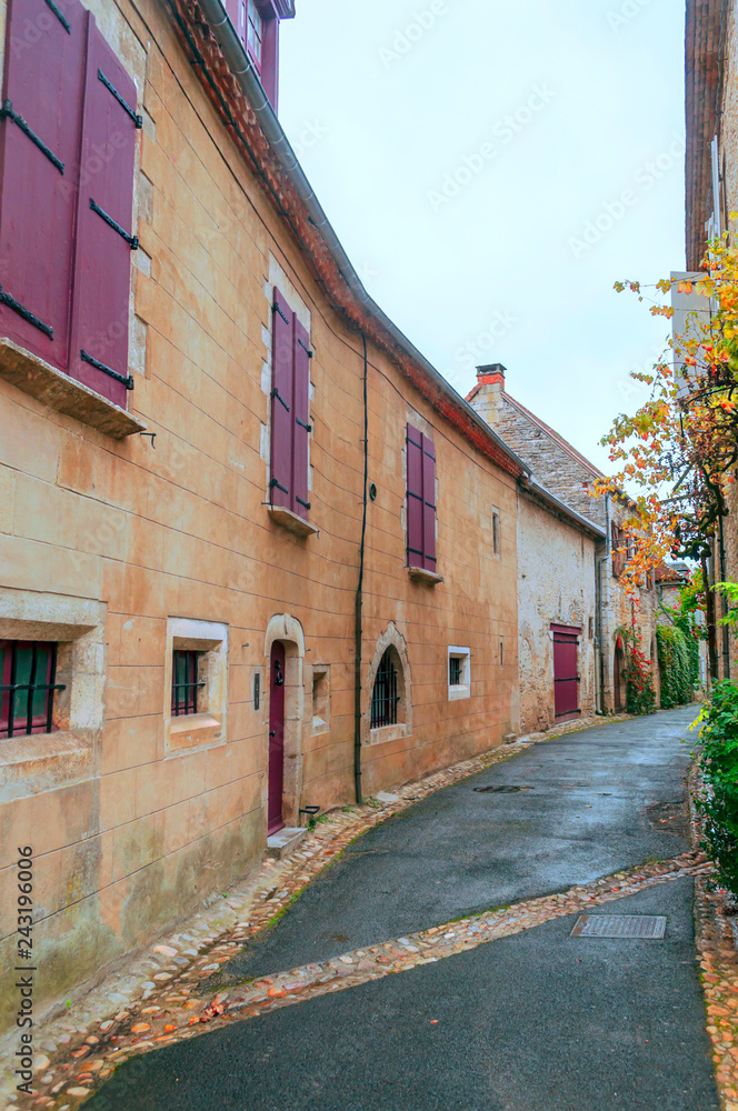 Medieval village of Aquitaine with its stone houses in the south of France on a cloudy day.