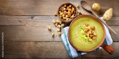 Canvas Print Leek and potato soup with croutons. Top view, space for text