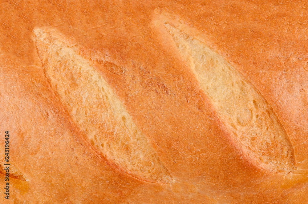Loaf of fresh crispy bread. Top view. Background Loaf of fresh crispy bread. Top view. Background