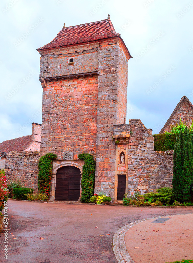 Medieval village of Aquitaine with its stone houses in the south of France on a cloudy day. Medieval village of Aquitaine with its stone houses in the south of France on a cloudy day.