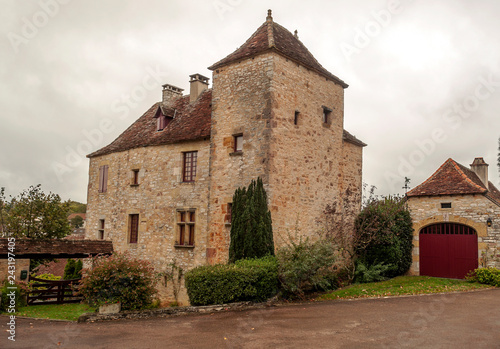 Medieval village of Aquitaine with its stone houses in the south of France on a cloudy day.