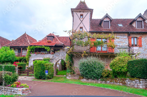 Medieval village of Aquitaine with its stone houses in the south of France on a cloudy day. photo