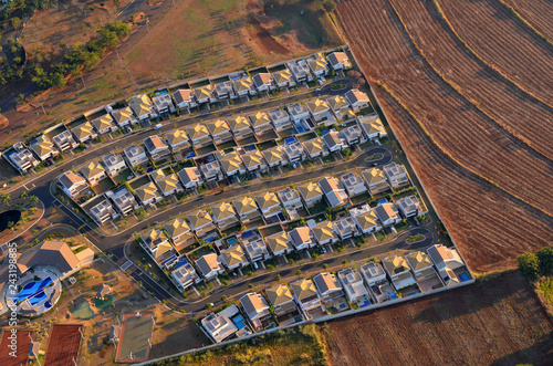 Gated community aerial view at sunrise.