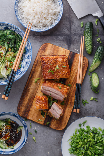 Chinese roasted pork belly on wooden cutting board