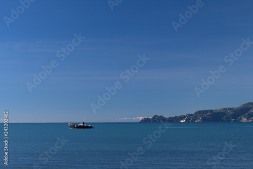 ship in the sea promontory italy horizon panorama horizon coast sky blue water seascape