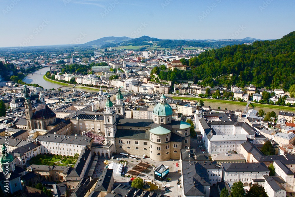Fototapeta premium Overlooking european city with river and mountains