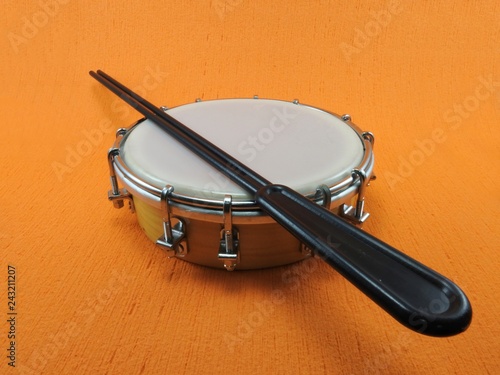 Tamborim and drumstick: a Brazilian percussion musical instrument. It is used to play samba, the famous Brazilian rhythm and has great prominence in the parades of samba schools, in the carnival. photo