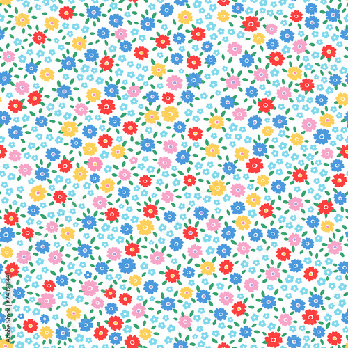 Ditsy floral seamless repeat pattern in happy bright colors and little leaves