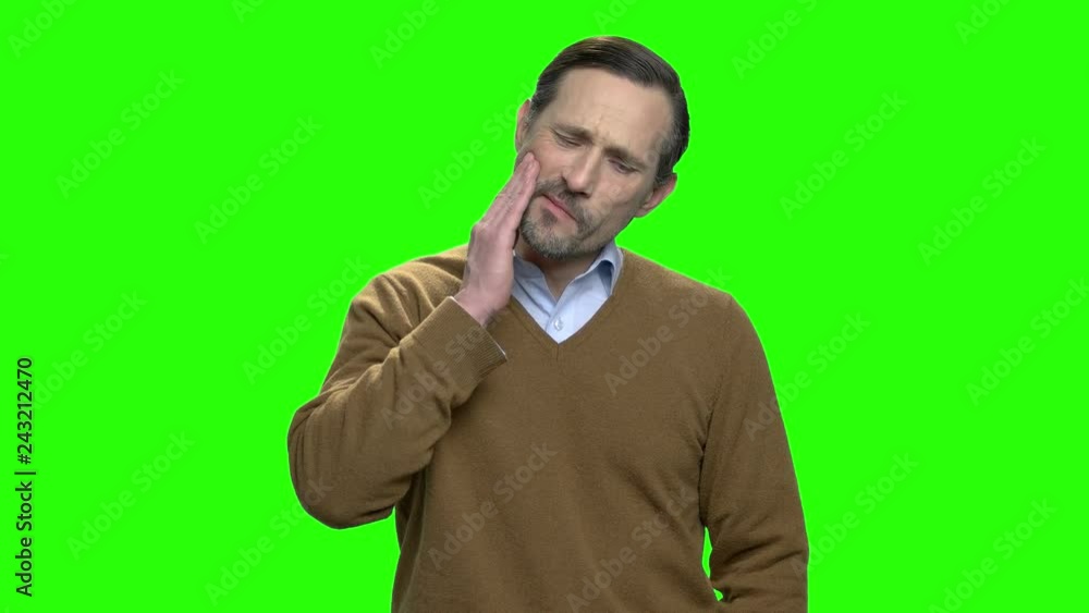 Portrait of a man experiencing toothache. Green screen hromakey background for keying. Portrait of a man experiencing toothache. Green screen hromakey background for keying.