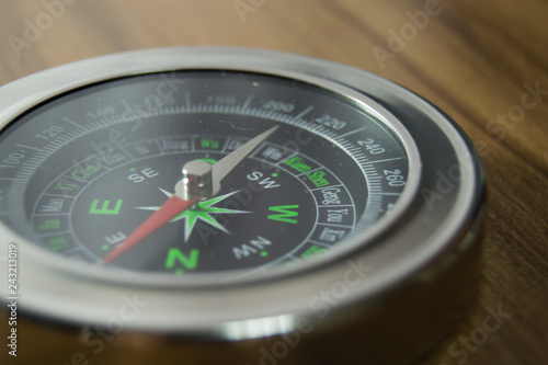 compass over a wooden table