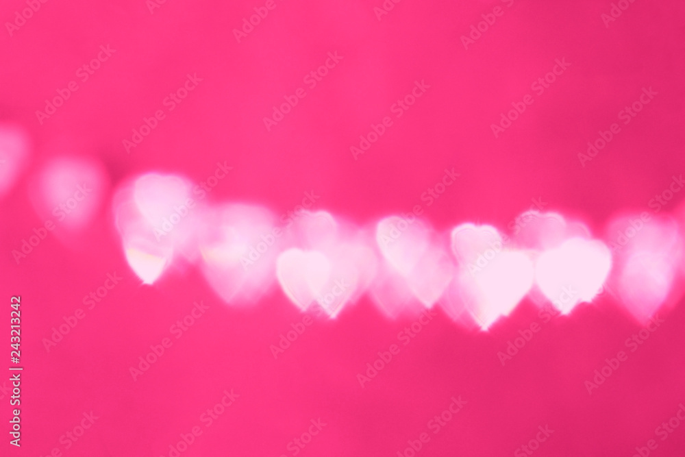 Defocus bokeh light filtered heart on the bright pink background