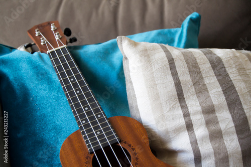 Ukulele over a sofa photo