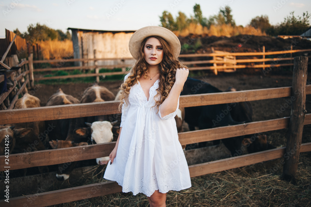 The girl in the white dress on the farm.