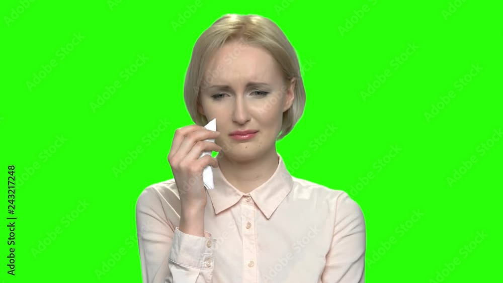 Portrait of sad crying mature business woman. Green hromakey background for keying. Portrait of sad crying mature business woman. Green hromakey background for keying.