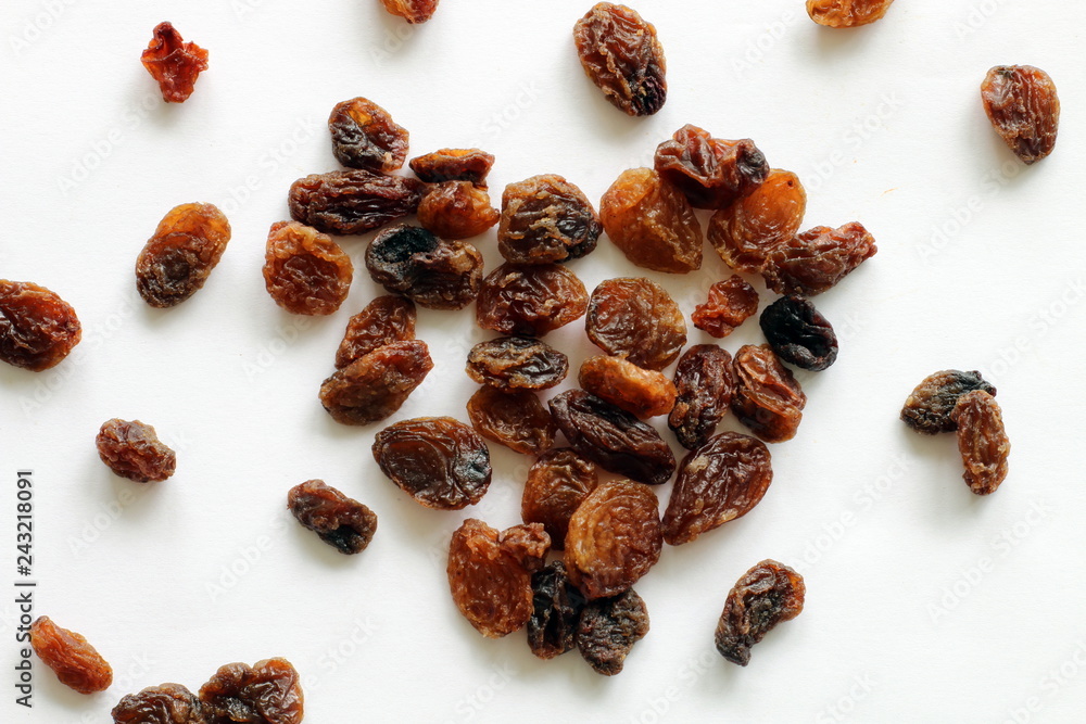 Obraz premium Heart made of raisins on white background