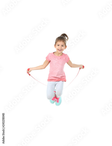Full length portrait of girl jumping rope on white background