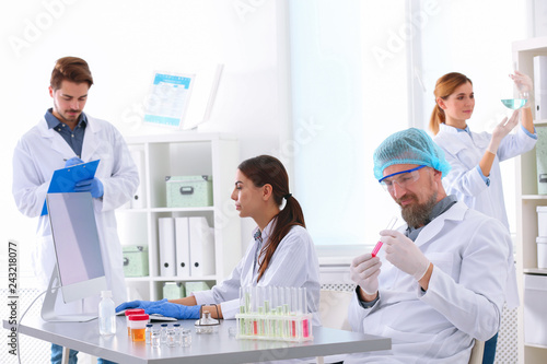 Scientists working in laboratory. Research and analysis