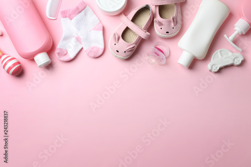 Flat lay composition with baby accessories on color background. Space for text