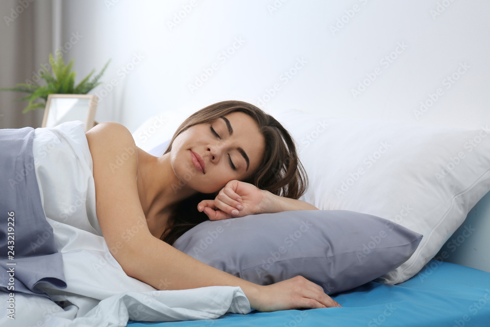 Young woman awakening at home in morning. Bedtime Young woman awakening at home in morning. Bedtime