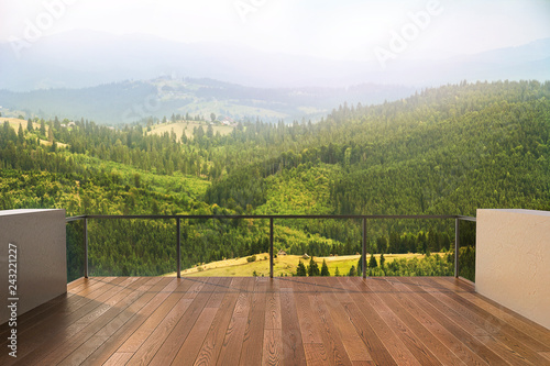 Balcony view of mountains. Landscape. Sunny Day. Terrace with a beautiful view.