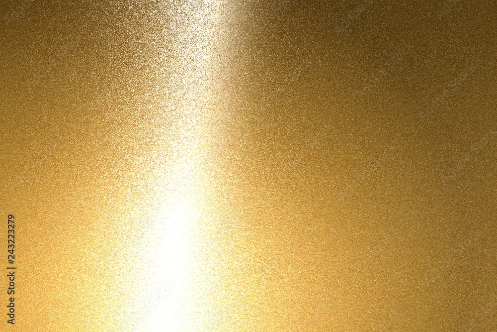 Fototapeta premium Światło świecące na tekstury szczotkowanej blachy z brązu, abstrakcyjne tło