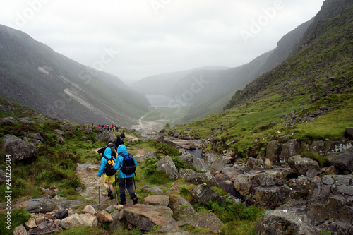 A group of tourists in the valley of Glendalough.