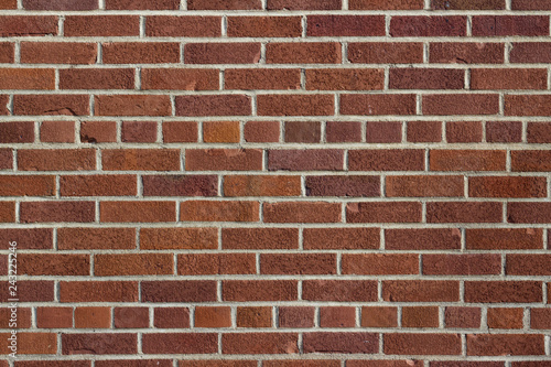 Grungy vintage reddish brown brick wall in common bond pattern