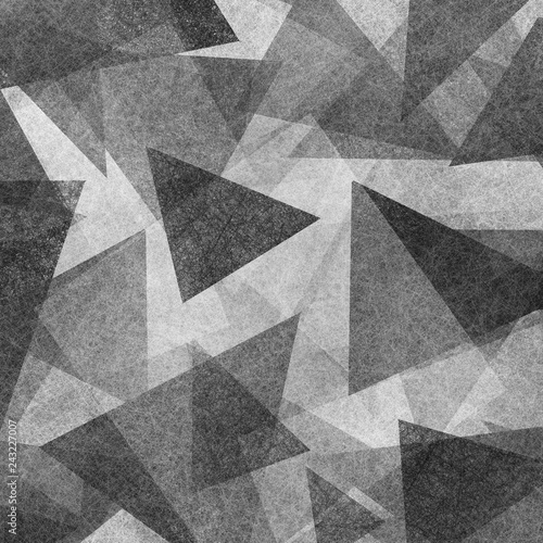 abstract geometric background design with black and white triangle shapes layered in modern abstract pattern with texture