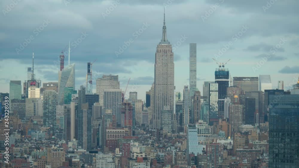 tighter timelapse shot of clouds passing over midtown Manhattan skyline tighter timelapse shot of clouds passing over midtown Manhattan skyline