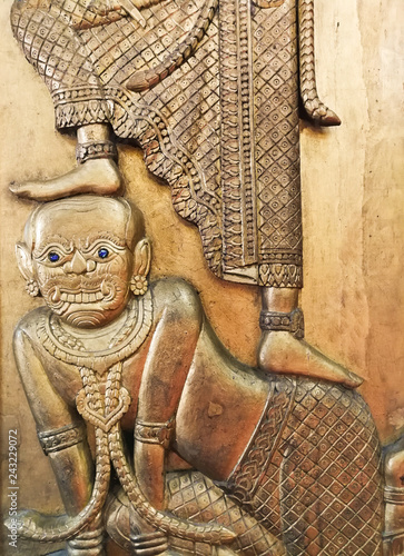 Wallpaper Mural Foot stepped on the giant head. Traditional Thai stucco pattern. Torontodigital.ca