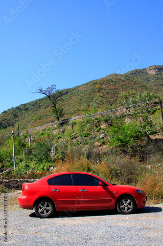 red car stop in mountain land