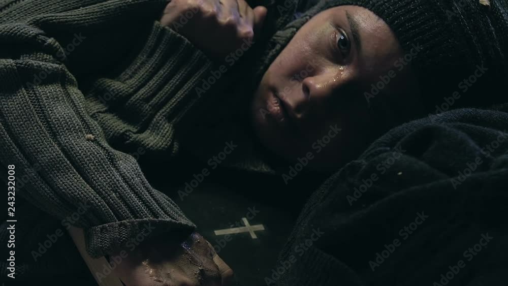 Sick poor woman hugging Bible, searching faith to survive in poverty, despair Sick poor woman hugging Bible, searching faith to survive in poverty, despair