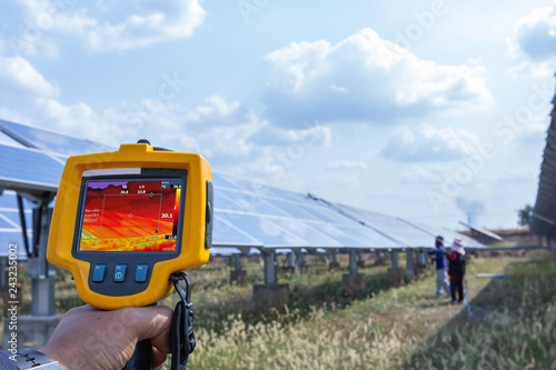 Thermoscan(thermal image camera), Industrial equipment used for checking the internal temperature of the machine for preventive maintenance, This is checking solar panel photo