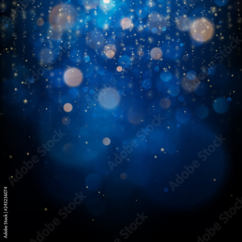 Blurred bokeh light on dark blue background. Christmas and New Year holidays template. Abstract glitter defocused blinking stars and sparks. EPS 10 © artifex.orlova