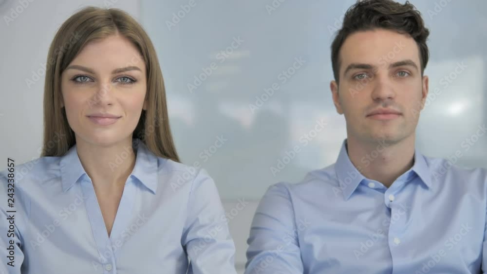 Young Business People Looking at Camera in Office, Colleagues Young Business People Looking at Camera in Office, Colleagues