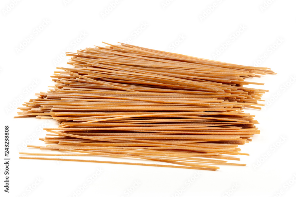 Raw soba, buckwheat noodles on a white background Raw soba, buckwheat noodles on a white background