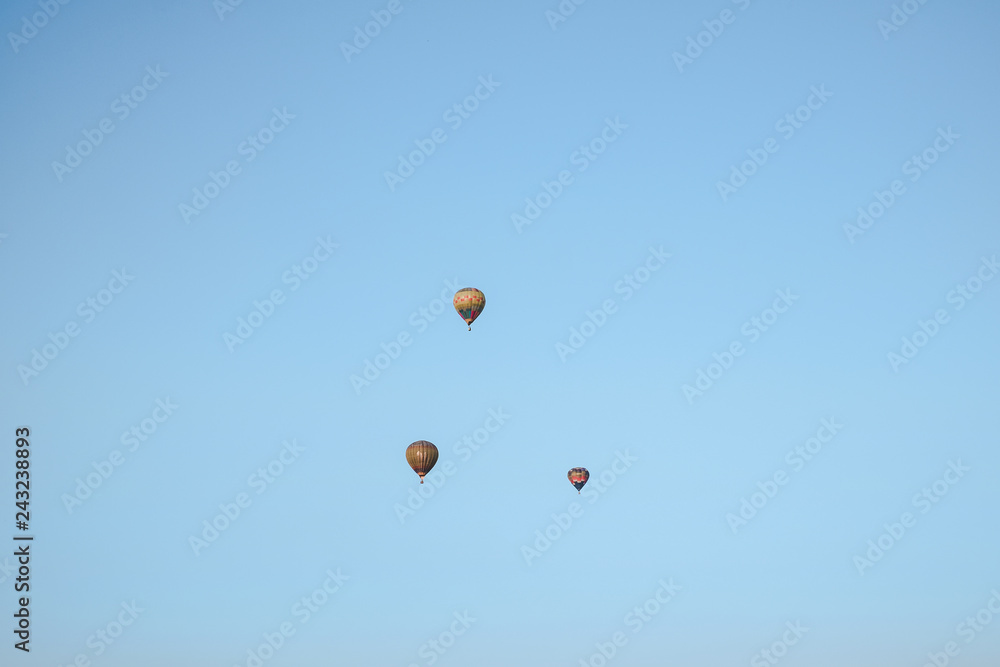 multicolored balloons in the city festival on blue sky background multicolored balloons in the city festival on blue sky background