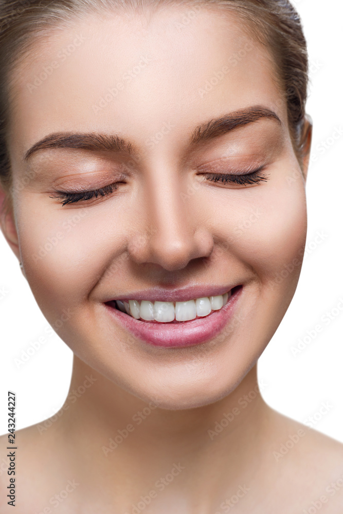 Young woman with toothy smile and closed eyes. Young woman with toothy smile and closed eyes.