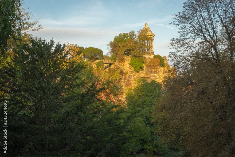 Paris, France - 10 14 2018: Neighborhood of Villette. The park Buttes-Chaumont at sunrise. Island of the temple of Sybille