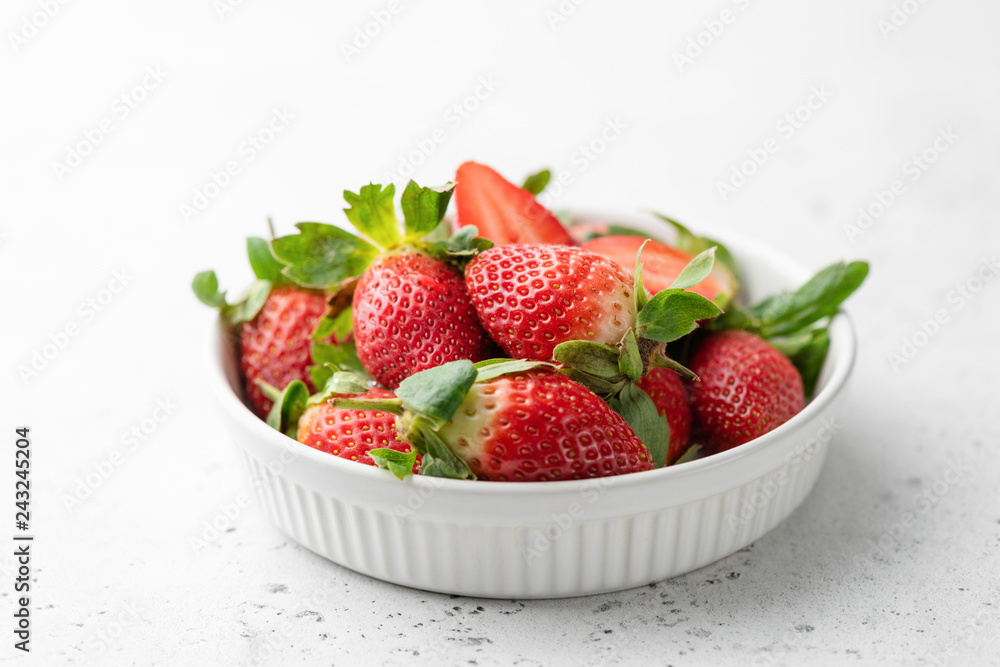 Fresh strawberries in bowl on white background, horizontal view, selective focus. Tasty strawberries. Healthy food Fresh strawberries in bowl on white background, horizontal view, selective focus. Tasty strawberries. Healthy food