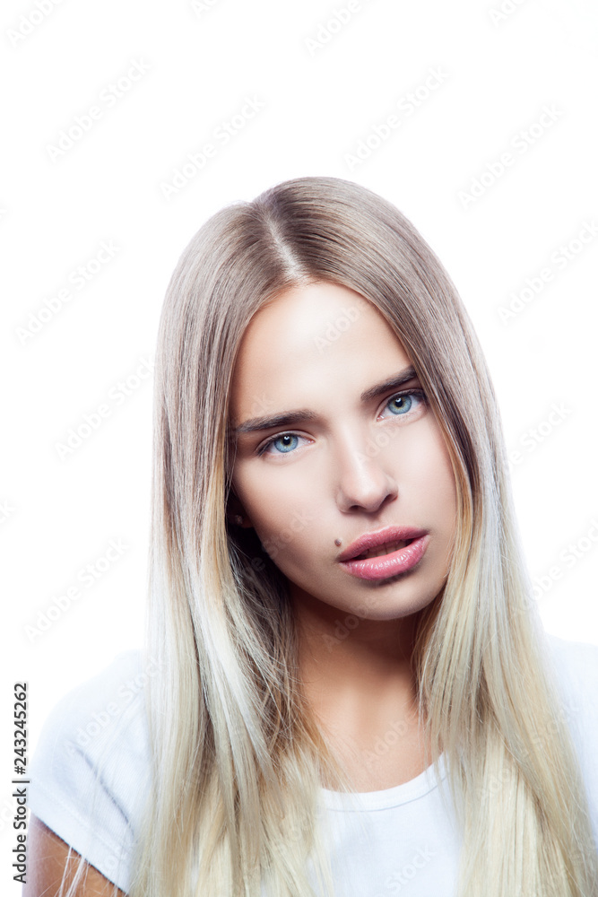 Lifestyle portrait of beautiful fashion model girl wearing white t-shirt. Natural make-up, hai style, clean skin. White background Lifestyle portrait of beautiful fashion model girl wearing white t-shirt. Natural make-up, hai style, clean skin. White background