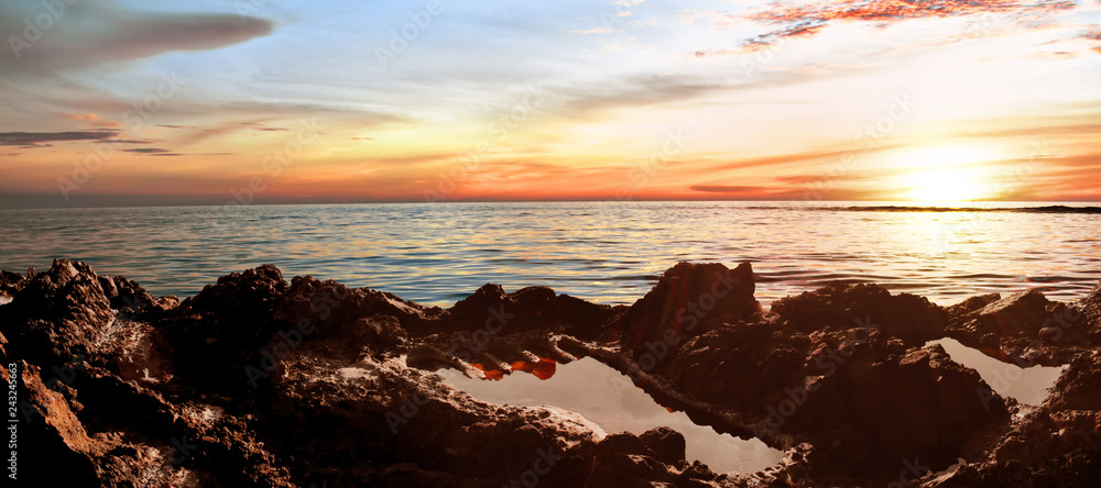 Fototapeta Tapak tuan aceh, rocky beach at sunset