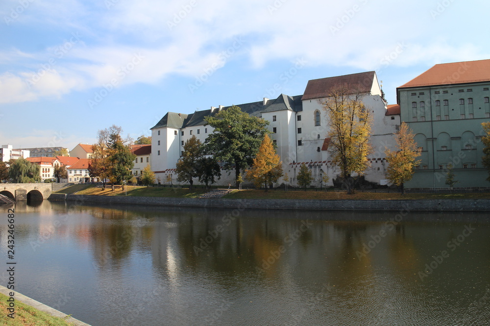 Prácheňské museum on shore of Otava river with a part of Kamenný bridge in Písek, Czech republic,